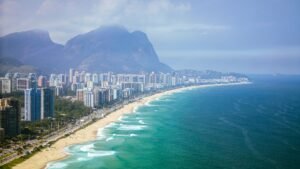 Residential towers along Barra da Tijuca beach with Pedra da Gávea in the background